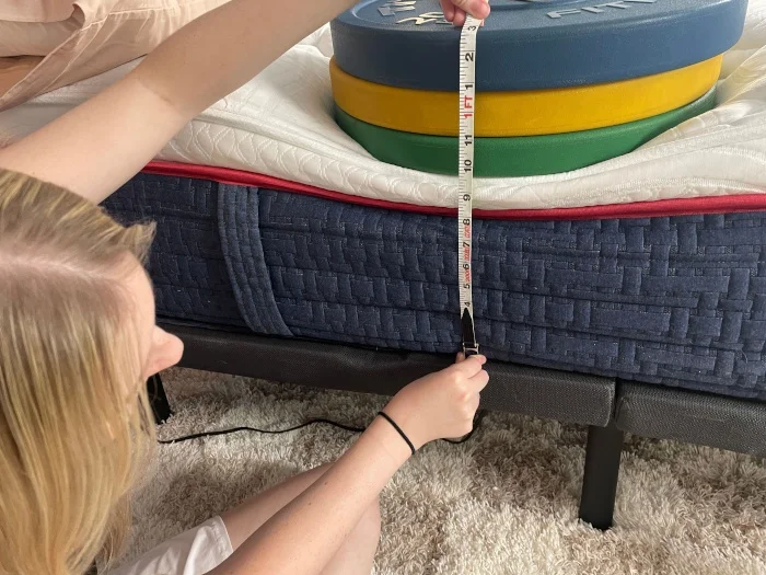 Measuring weight plates to evaluate edge support of the Wolf Mattress.