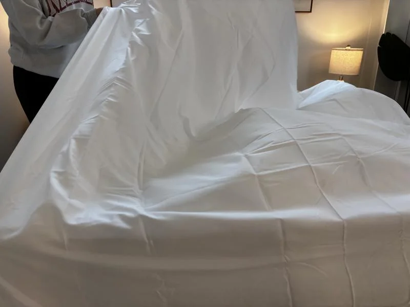 Making a bed with Miracle Made Self-Cooling and Cleaning Sheets