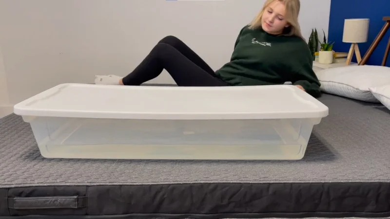 Our tester performs a ripple test on a Layla Signature Hybrid Mattress