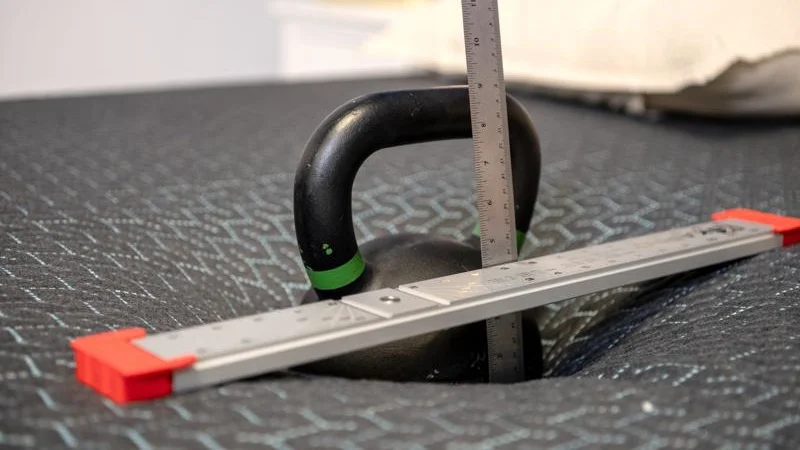 Kettlebell sinkage test on the Tuft & Needle Mint Hybrid Mattress