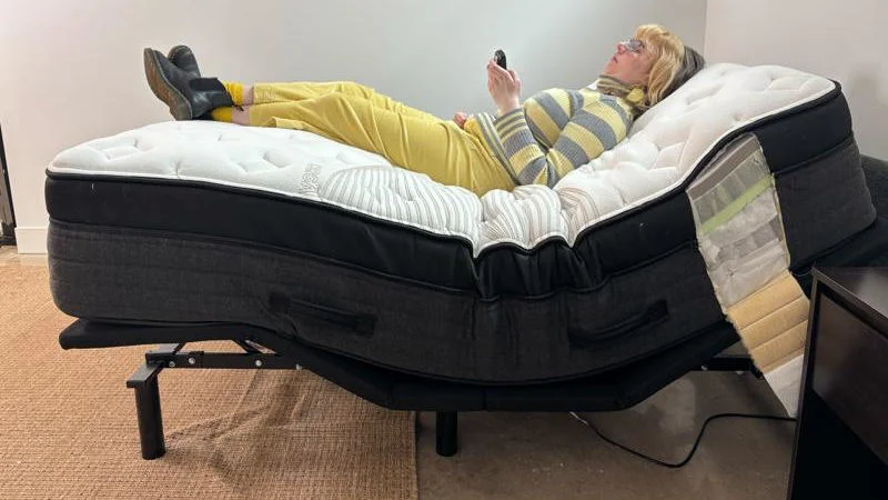 Testing the Nolah Evolution Hybrid Mattress on an adjustable bed.