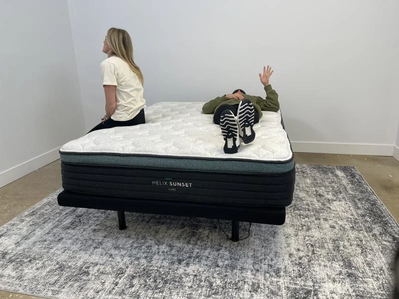 Our product testers partner up for motion isolation testing of the Helix Sunset Luxe Mattress.