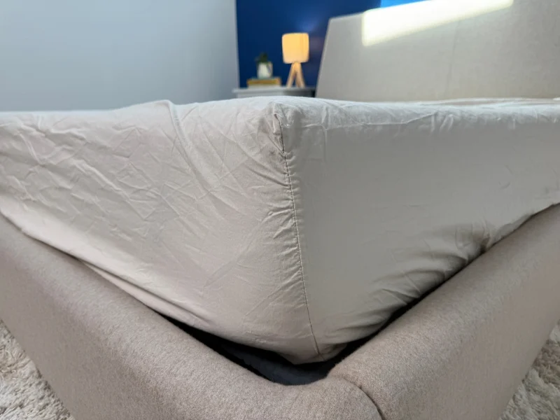 A set of Verlee Organic Cotton Percale sheets anchored at the corner of a mattress