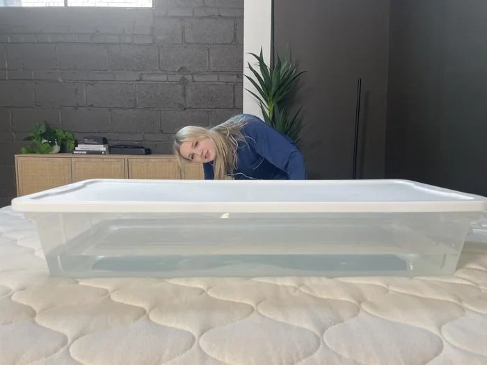 Our tester performs a ripple test on the WinkBed EcoCloud Hybrid Mattress