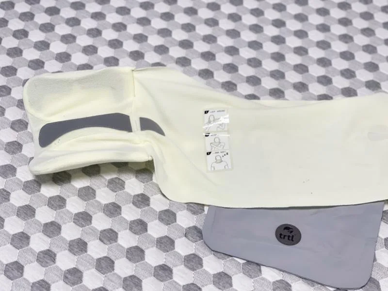 An unwrapped trtl Travel Pillow at the Sleepopolis studio.