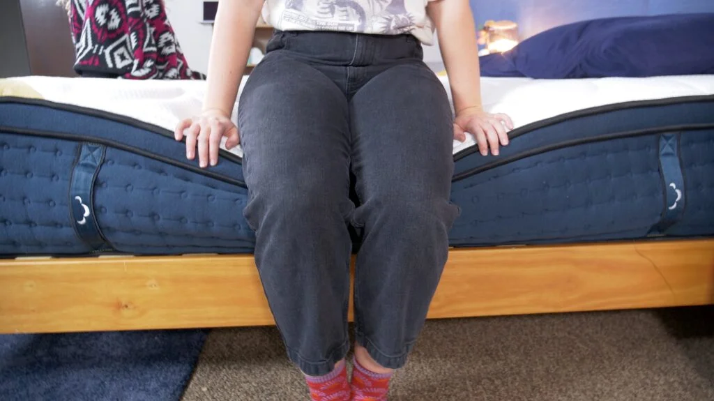 Amelia testing edge support on DreamCloud Premier Rest