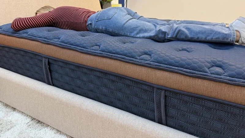 Our tester stomach sleeping on the Brooklyn Bedding Aurora Luxe