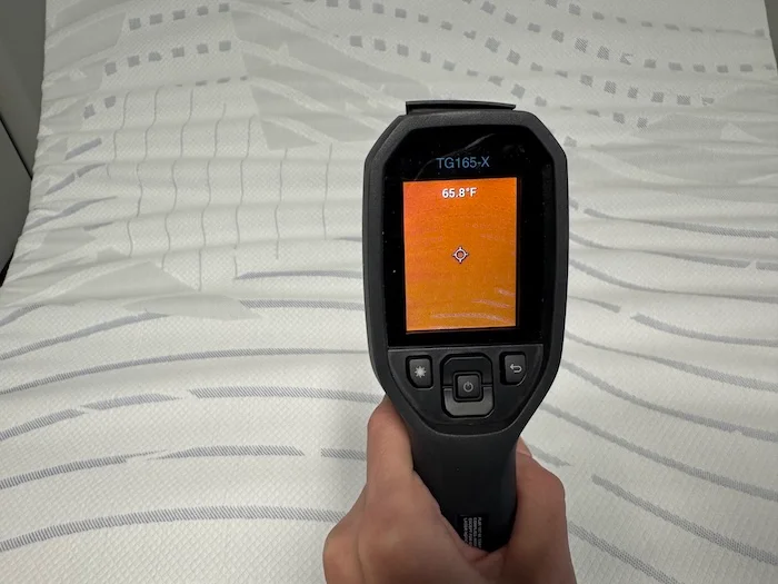 A closeup of a thermal gun reading the neutral temperature of the BodiPedic 12". The screen reads 65.8 degrees.