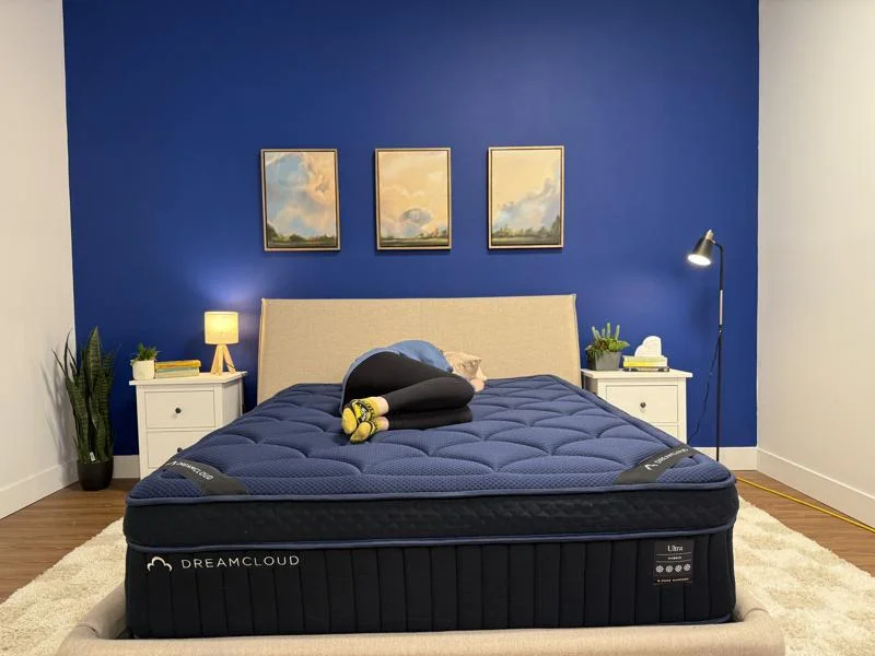 Our tester side sleeping on the DreamCloud Ultra Hybrid Mattress