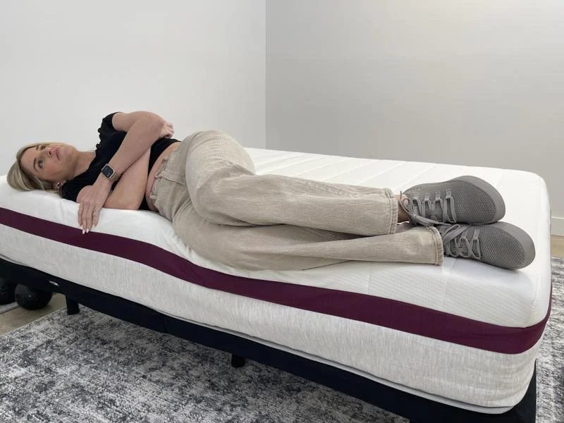 Our tester side-sleeping full body edge support test of the Helix Dusk Mattress