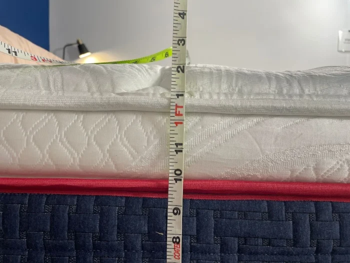 Measuring the thickness of the pillowtop on a Wolf Mattress.