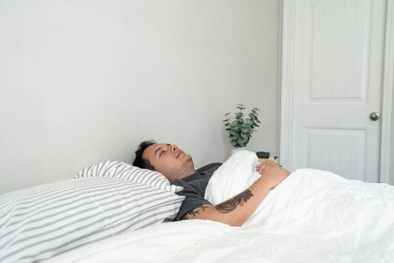 Our tester using a Cozy Earth Silk Comforter