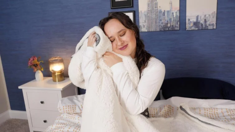 woman snuggling up to the blanket