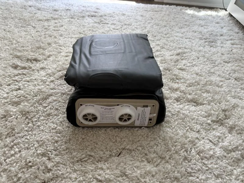 A folded-up King Koil Luxury Plush Pillow Top Air Mattress