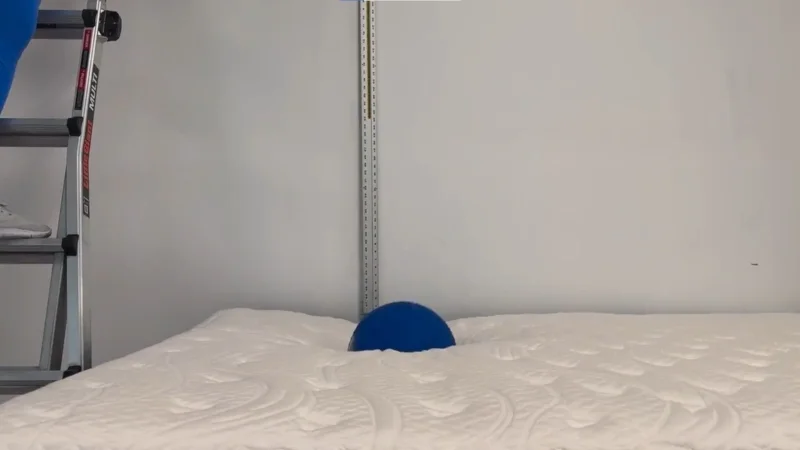 Our testers doing a bounce test on the Glacier Original Hybrid Mattress