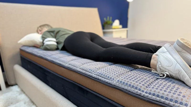 Our tester stomach sleeping on the Brooklyn Bedding CopperFlex Mattress