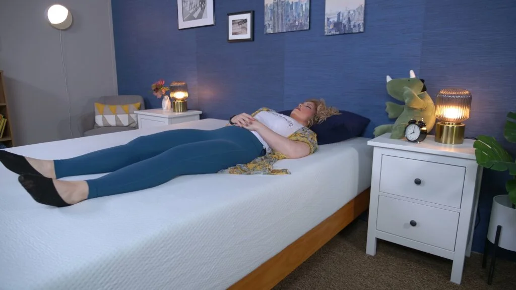 Nichole back sleeping on the Zinus Green Tea Memory Foam mattress.