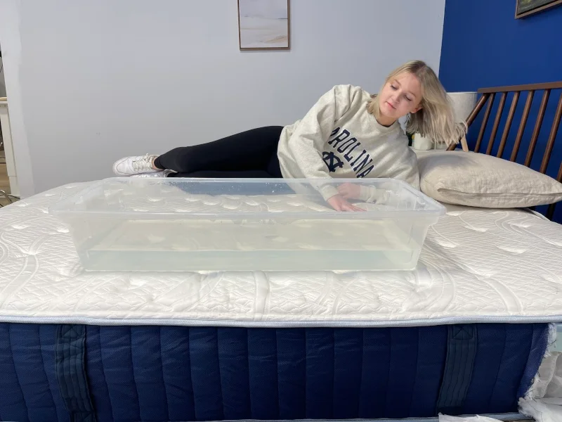 Our tester performs a ripple test on the Glacier Original Hybrid Mattress