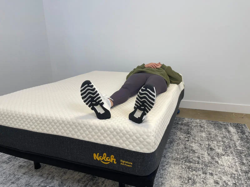 Our tester back-sleeping on the Nolah Signature Mattress