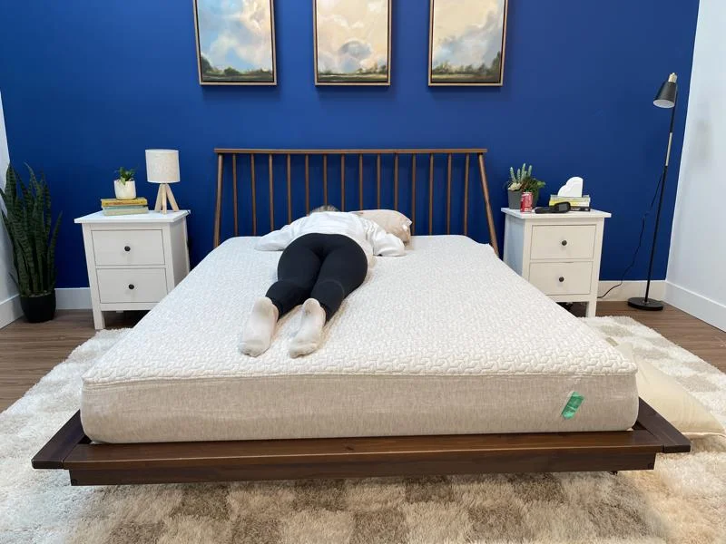 Our tester stomach-sleeping on the Tuft & Needle Mattress