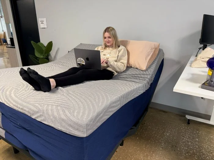 Our tester using a SweetNight CoolNest with an adjustable bed