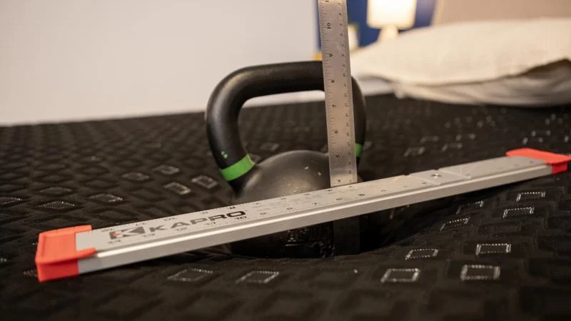 Kettlebell sinkage test on the Beautyrest Black Hybrid XCS Mattress