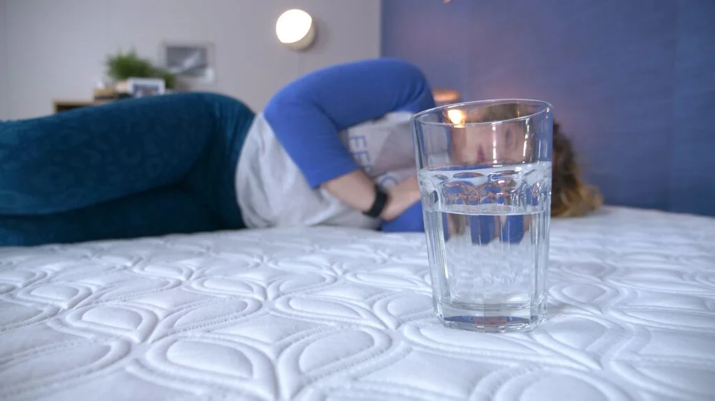 Nichole doing the water test on the Cocoon Chill Mattress Construction