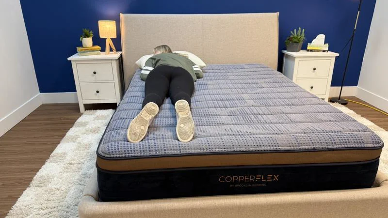 Our tester stomach sleeping on the Brooklyn Bedding CopperFlex Mattress