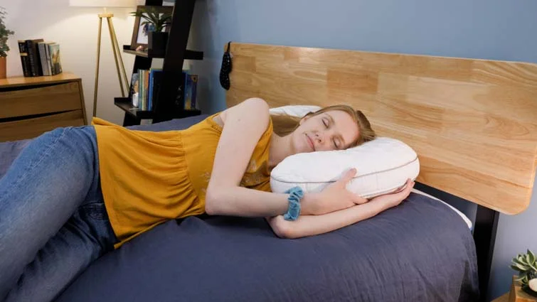 Side sleeping on the bear contour pillow