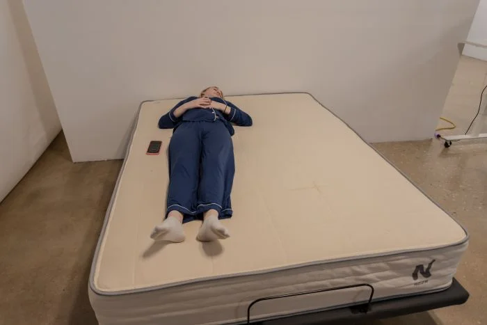A woman back-sleeping on the Nolah Natural mattress.