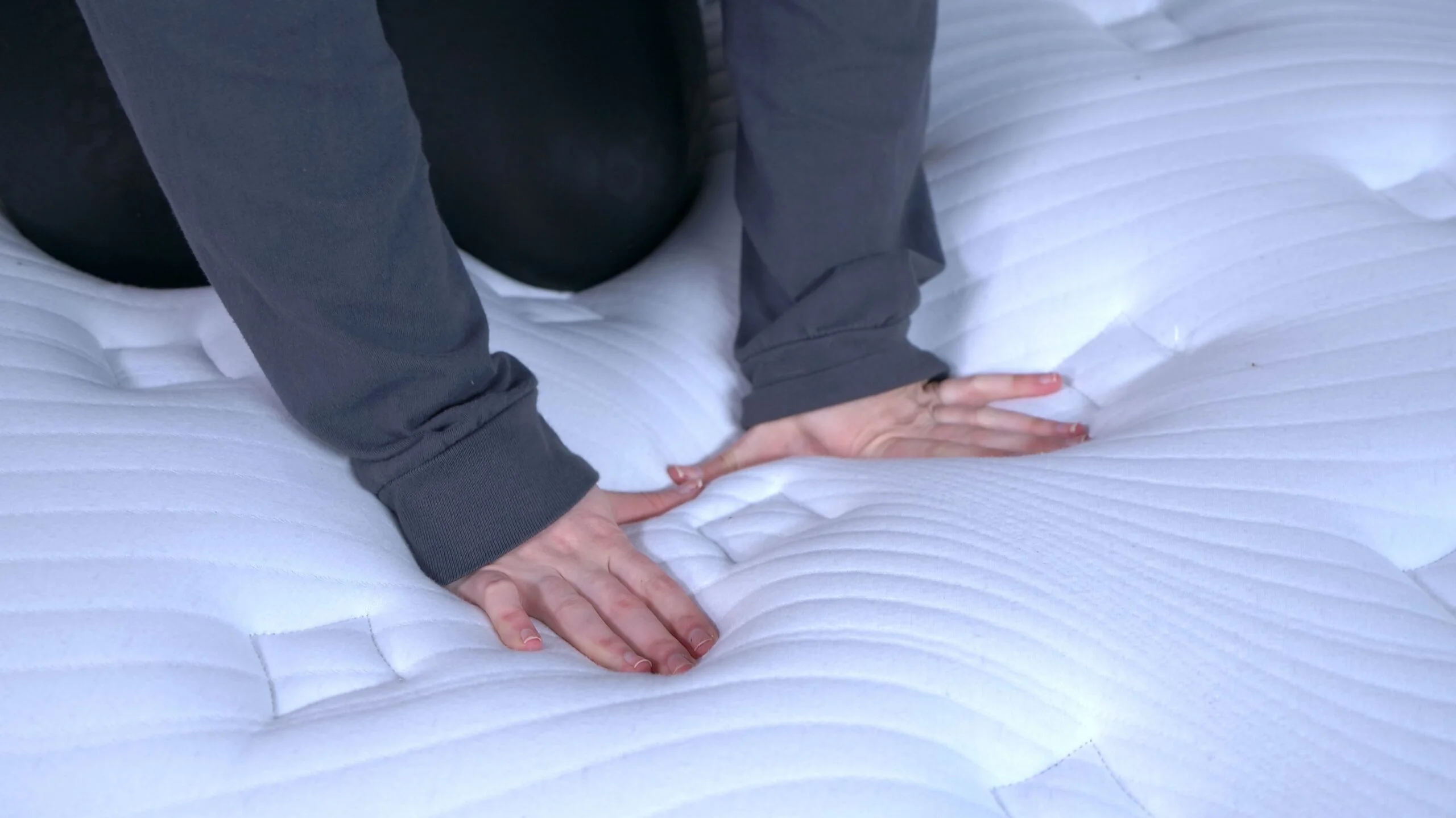 Nichole touching the cover of the Bear Elite Hybrid