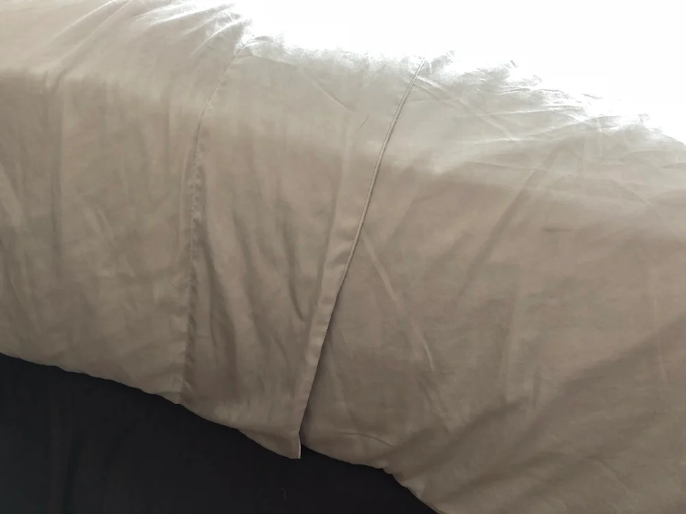 Parachute Sateen Sheets tucked under mattress