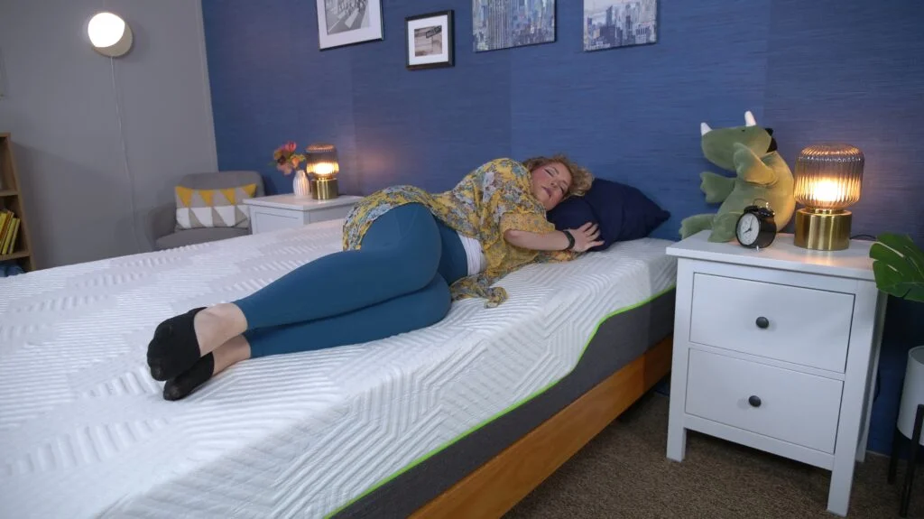 Nichole side sleeping on the Lucid Hybrid mattress.