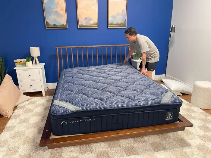 The Dreamcloud Luxe Hybrid mattress on a frame