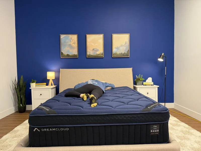 Our tester stomach sleeping on the DreamCloud Ultra Hybrid Mattress