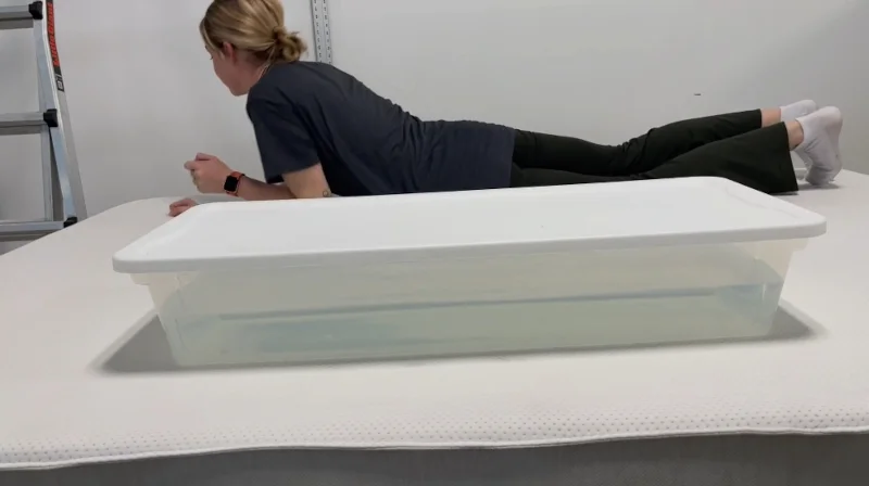 Our tester performs a ripple test on a Boring AF Mattress