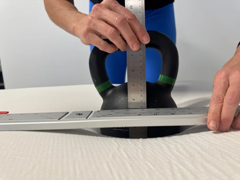 Our tester performing a sinkage test on a PolySleep Sierra Mattress