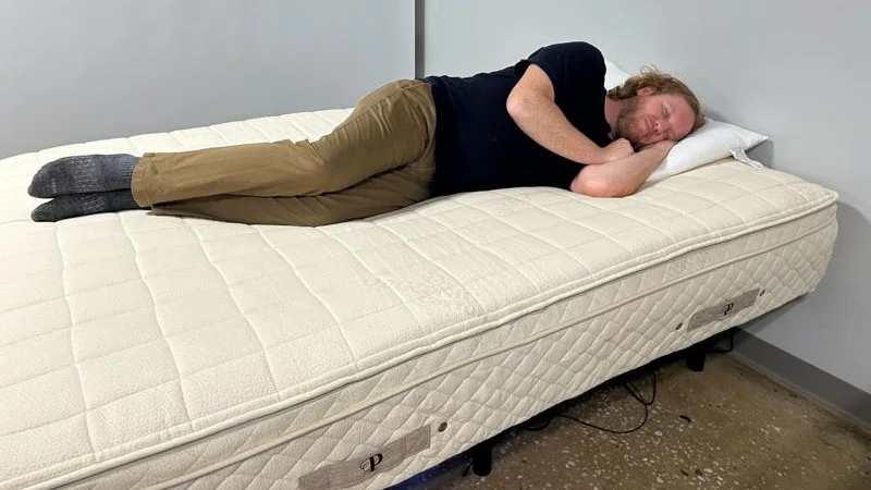 Our tester side sleeping on the PlushBeds Botanical Bliss Mattress