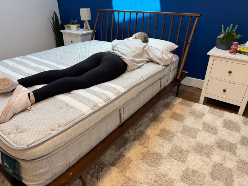 Our tester stomach sleeping on a Leesa Plus Hybrid Mattress