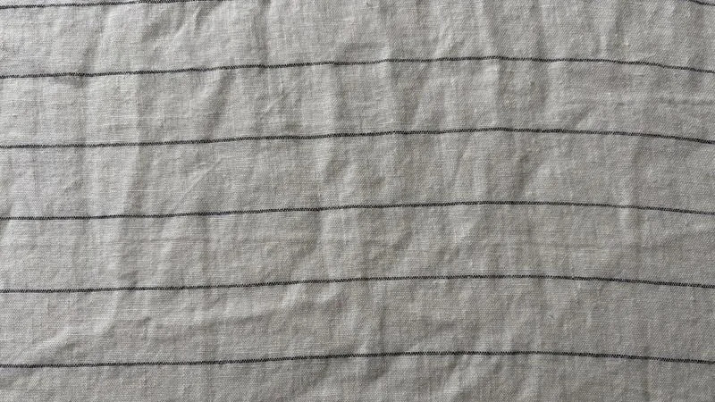 A close look at the texture and weave of Silk & Snow Flax Linen Sheets
