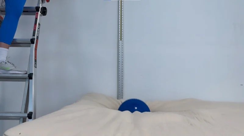 Our tester performs a bounce test on the Avocado Eco Organic Mattress