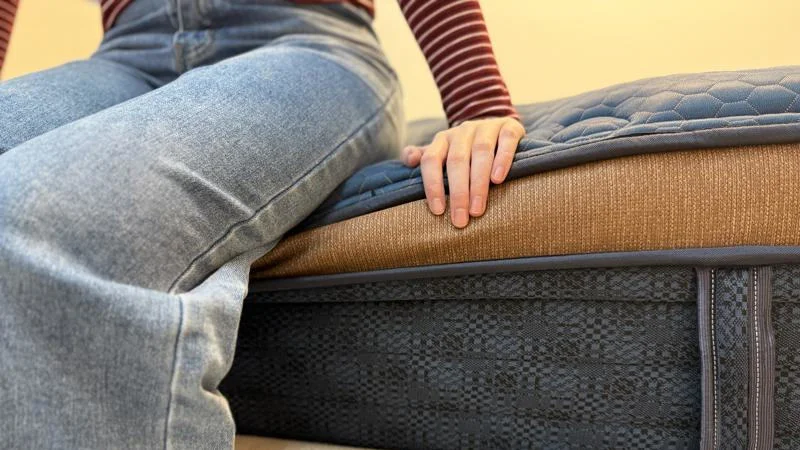 Seated edge support test on the Brooklyn Bedding Aurora Luxe mattress