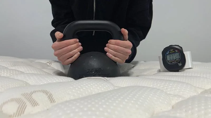 Kettlebell response test on the Saatva Solaire Mattress