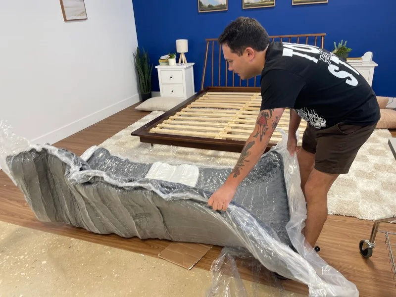 Our tester unboxing a Layla Signature Hybrid Mattress
