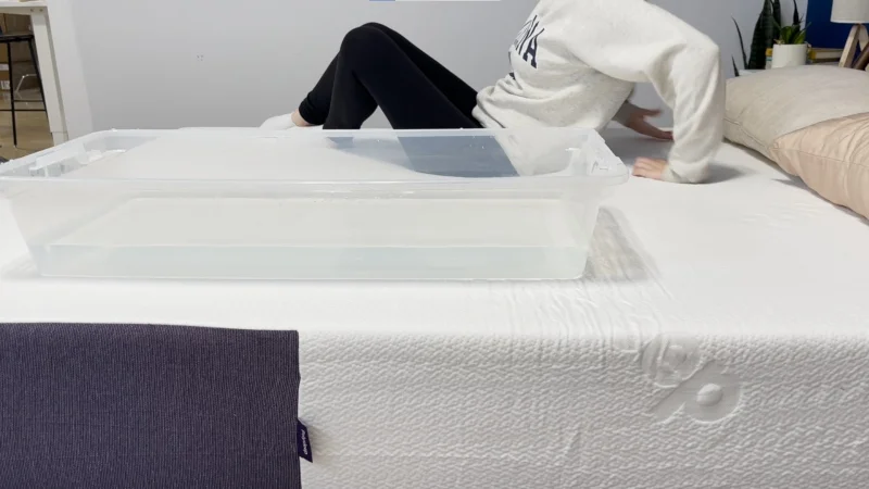 Our tester performs a ripple test on a Polysleep Luna Mattress
