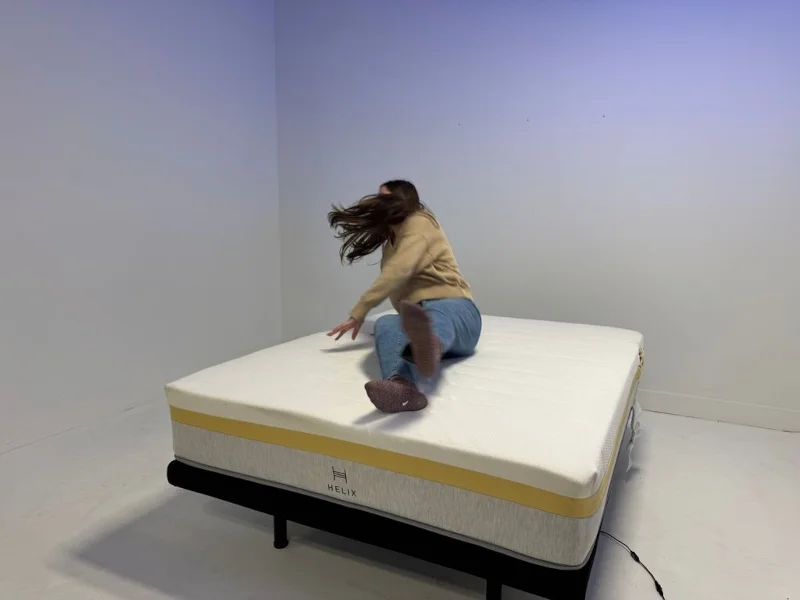 Our tester changes positions on a Helix Dawn Mattress to assess it's responsiveness