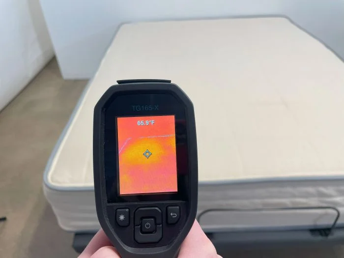 Temp Gun reading before laying on the Nolah Natural mattress