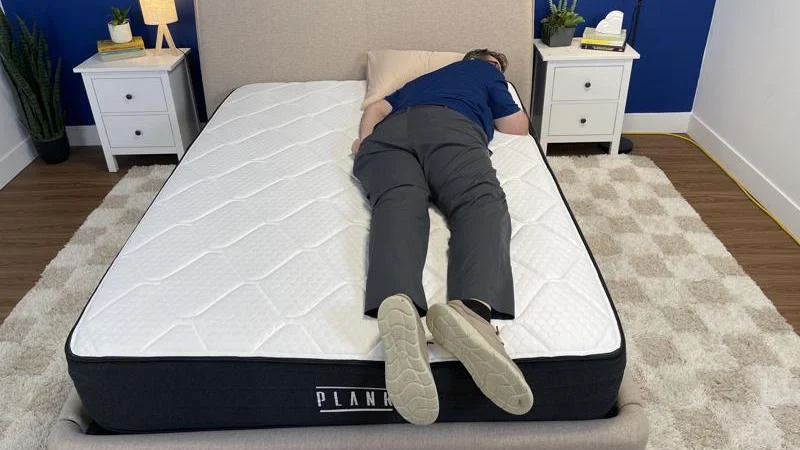 Our tester stomach sleeping on the Brooklyn Bedding Plank Firm Luxe Mattress