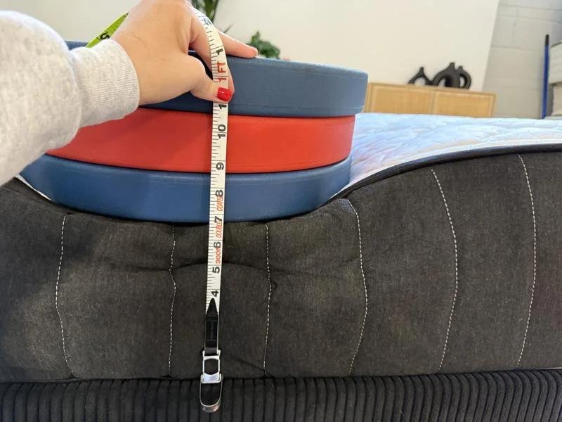 Measuring the deflection of weight plates on the edge of the Titan Plus Core Mattress