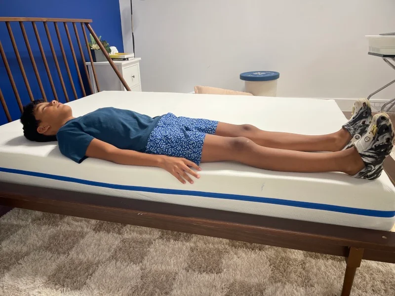 Our young tester back-sleeping on a Nectar Kids Mattress
